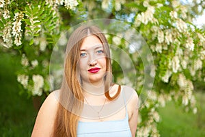 Portrait of young girl long hair plus size spring surrounde