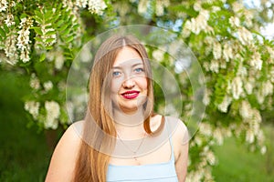 Portrait of young girl long hair plus size spring surrounde