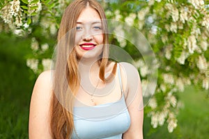 Portrait of young girl long hair plus size spring surrounde