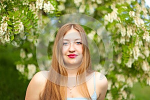 Portrait of young girl long hair plus size spring surrounde