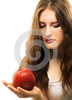 Portrait of young girl with red apple