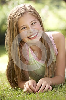 Portrait Of Young Girl Relaxing In Countryside