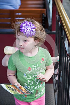 Portrait of young girl riding on train