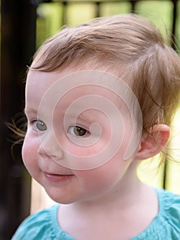 Portrait of young girl riding on train