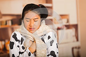 Portrait of young girl with skin problem with a wool sweater around his neck