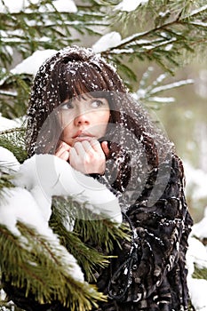 Portrait of a young girl with the snow in her hair