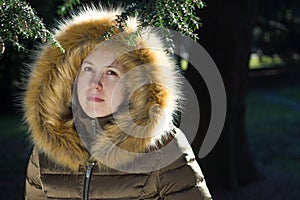 Portrait of a young girl / teenager in the park; looking depress