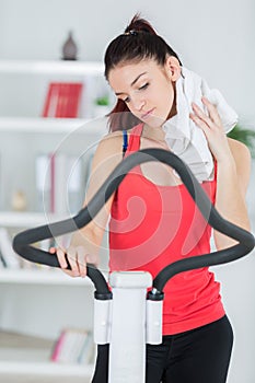 Portrait young girl training on stepping machine