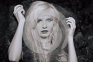 Portrait of a young girl in a veil, black and white photo