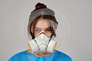 Portrait of a young girl wearing respiratory mask to protect from coronavirus.