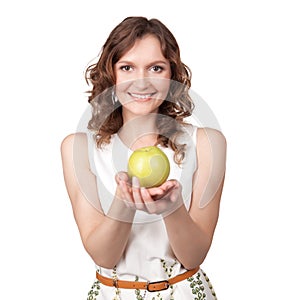 Portrait of young girl which gives of a green apple