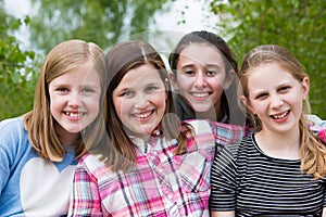 Portrait Of Young Girls Having Fun In Park Together