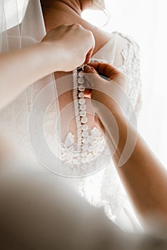 Portrait of young gorgeous bride on the balcony