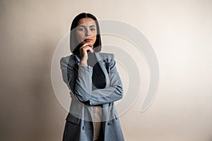 Portrait of young gorgeous businesswoman wearing a suite in studio