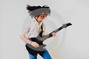 Portrait of young guitarist with gesture on his face