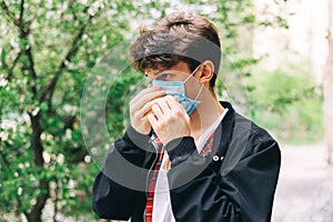 Portrait of a young guy with a mask on his face. Coronavirus2020