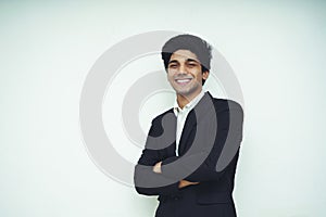 Portrait of a Young Handsome Asian Business man wearing black coat and white shirt standing in front of a white background,