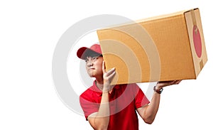 Portrait of young handsome Asian delivery man carrying paper parcel.