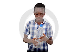 portrait of young handsome boy looking at bottle of water in han