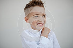 Portrait of young handsome boy with stylish haircut