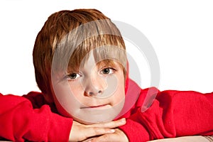 Portrait of young handsome boy wearing red hoodie