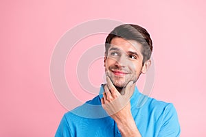 Portrait of young handsome dreamy positive guy look copyspace thinking advertisement isolated on pink color background