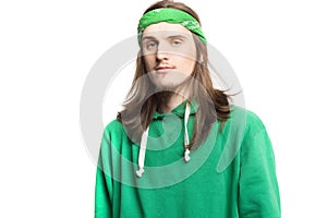 Portrait of young handsome happy man in green hoodie looking at the camera agains white background. Lifestyle and people concept