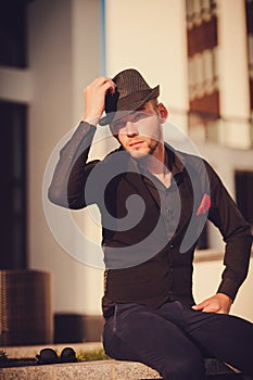 Portrait of a young handsome man in hat