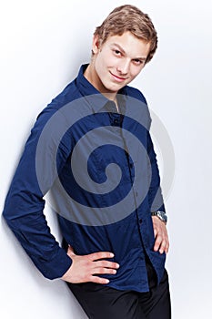 Portrait of a young handsome man wearing blue shirt on