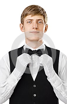 Portrait of young handsome waiter fixing his bow tie on a suit