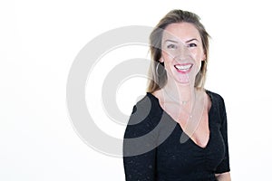 Portrait of young happy blond woman looks in camera aside copy space white background