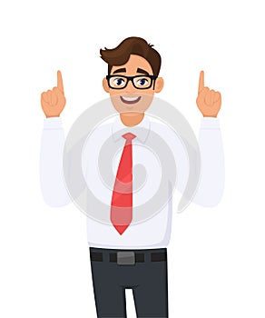 Portrait of young happy businessman pointing hand index fingers up, concept of advertisement product,introduce something.