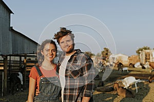 Portrait of a young happy couple at a farm