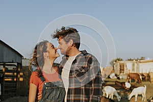 Portrait of a young happy couple at a farm