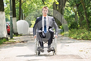 Young Disabled Man On Wheelchair