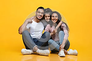 Portrait Of Young Happy Middle Eastern Family With Little Daughter Posing Together