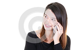 Portrait of young happy pretty woman talking on mobile phone outside looking side