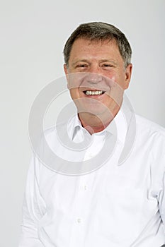 Portrait of young happy smiling business man, isolated over whit