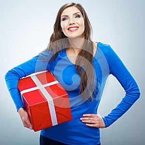 Portrait of young happy smiling woman hold red gift box. Isolat