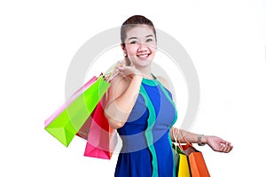 Portrait of young happy smiling woman with shopping bags