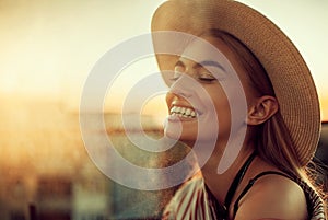 Portrait of young happy woman against of urban background.