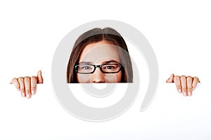 Portrait young happy woman with blank board