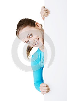 Portrait young happy woman with blank board