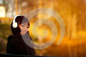 Portrait of young happy woman with headphones