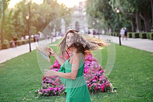 Portrait of a young happy woman in the park