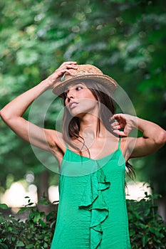 Portrait of a young happy woman in the park