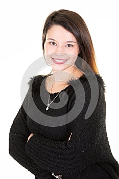 Portrait of a young happy woman smiling arms crossed on white background looking in camera