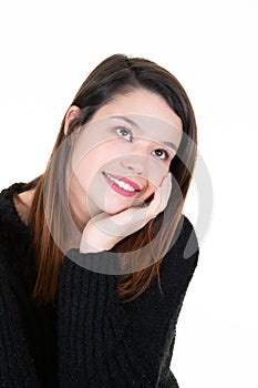 Portrait of a young happy woman smiling and thinking on white background looking up