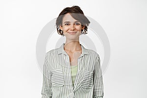 Portrait of young happy woman smiling, wearing casual shirt. Female entrepreneur smile with confident face, standing