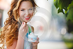 Portrait of a young happy woman in summer